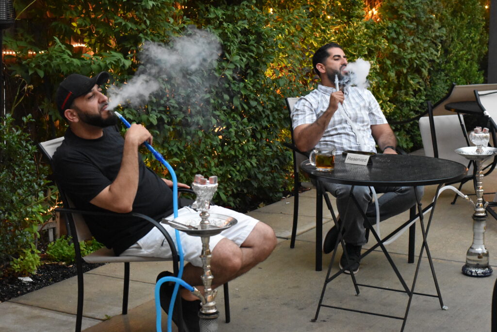 Friends watching the game with hookah at Arabian Cafe, Paterson NJ