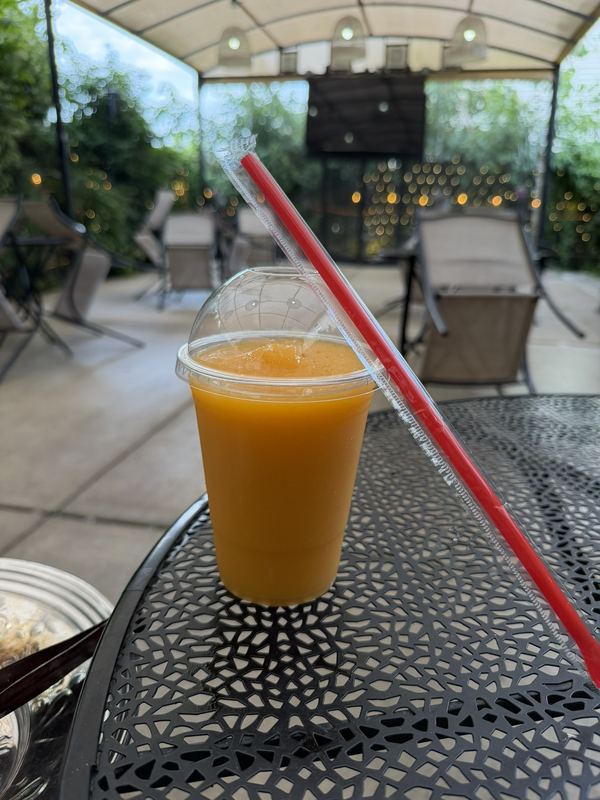 Fresh juice and hookah on the patio at Arabian Cafe