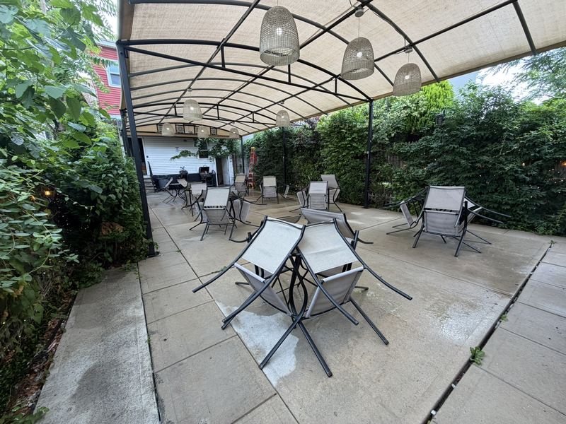 Garden patio seating under the pergola at Arabian Cafe